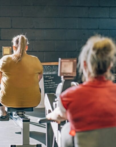 Women exercising on rowing machines at Strength Valley